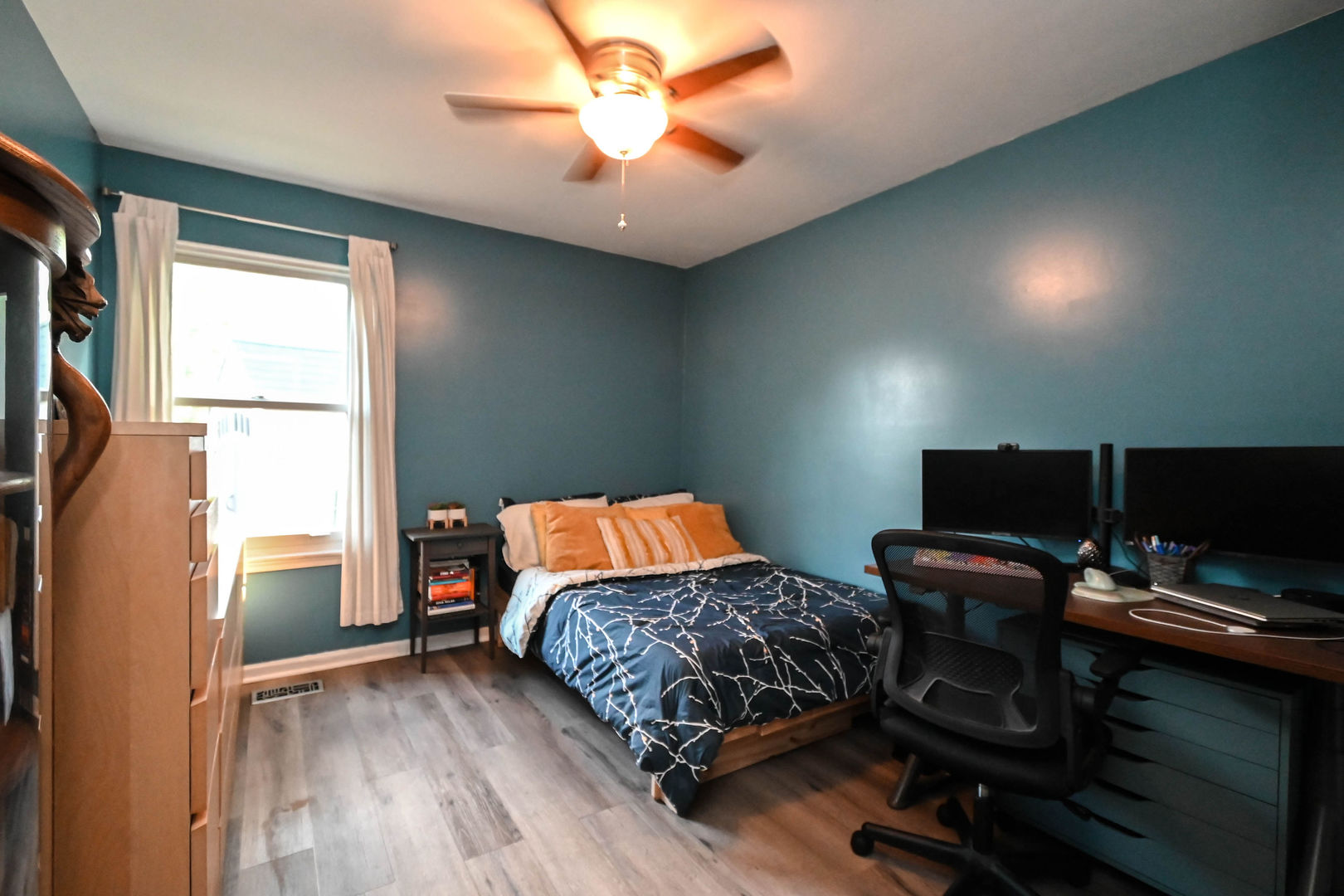1333 Regency Lane Round Lake, IL 60073 - Photo 20 of 31 a bedroom with a bed and a flat screen tv