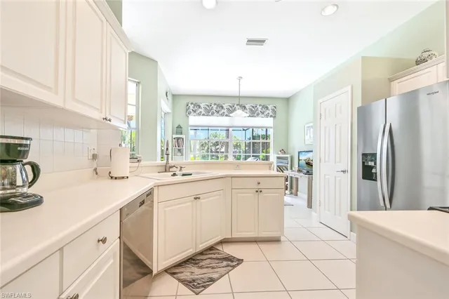 a kitchen with a sink stove and refrigerator