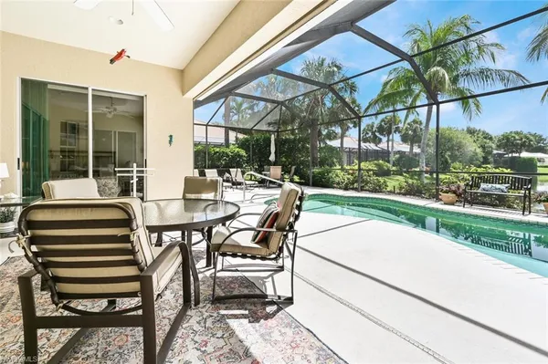 a view of a patio with a table and chairs