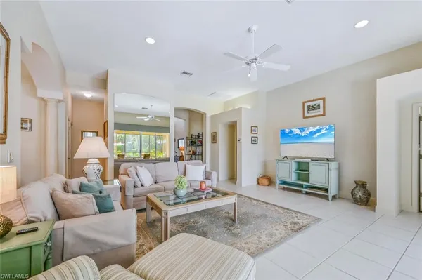 a living room with furniture and a table