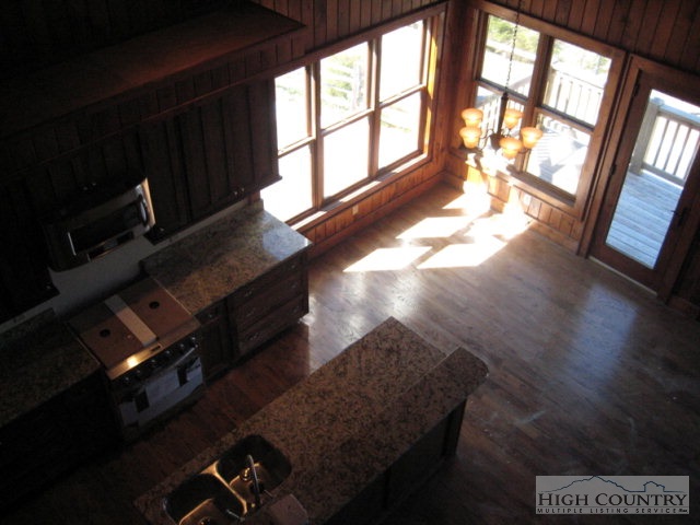145-8 Banner Road Southwest, Unit 8 Banner Elk, NC 28604 - Photo 7 of 22 a living room with furniture and a large window