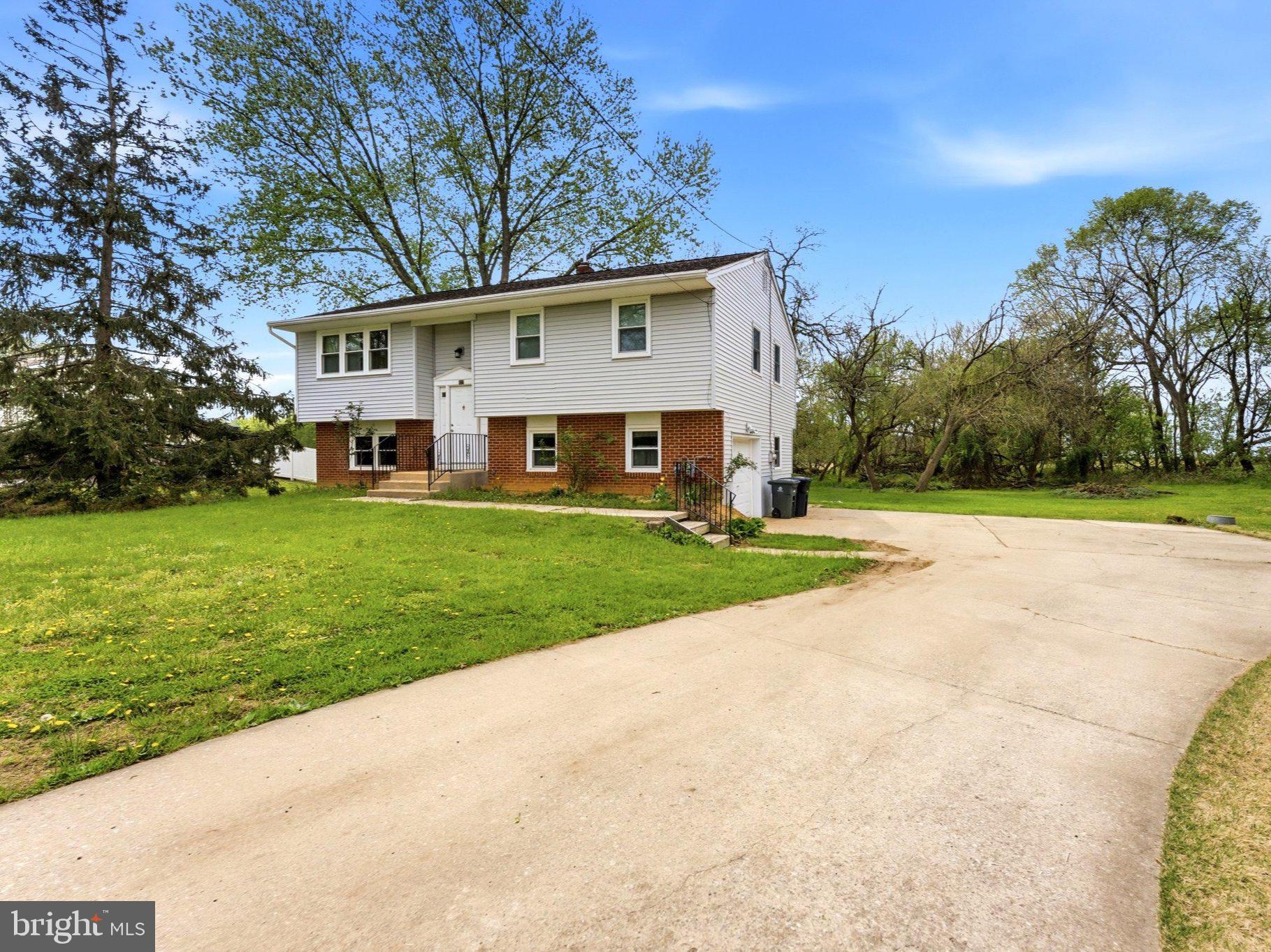 Charming home on spacious green lot.