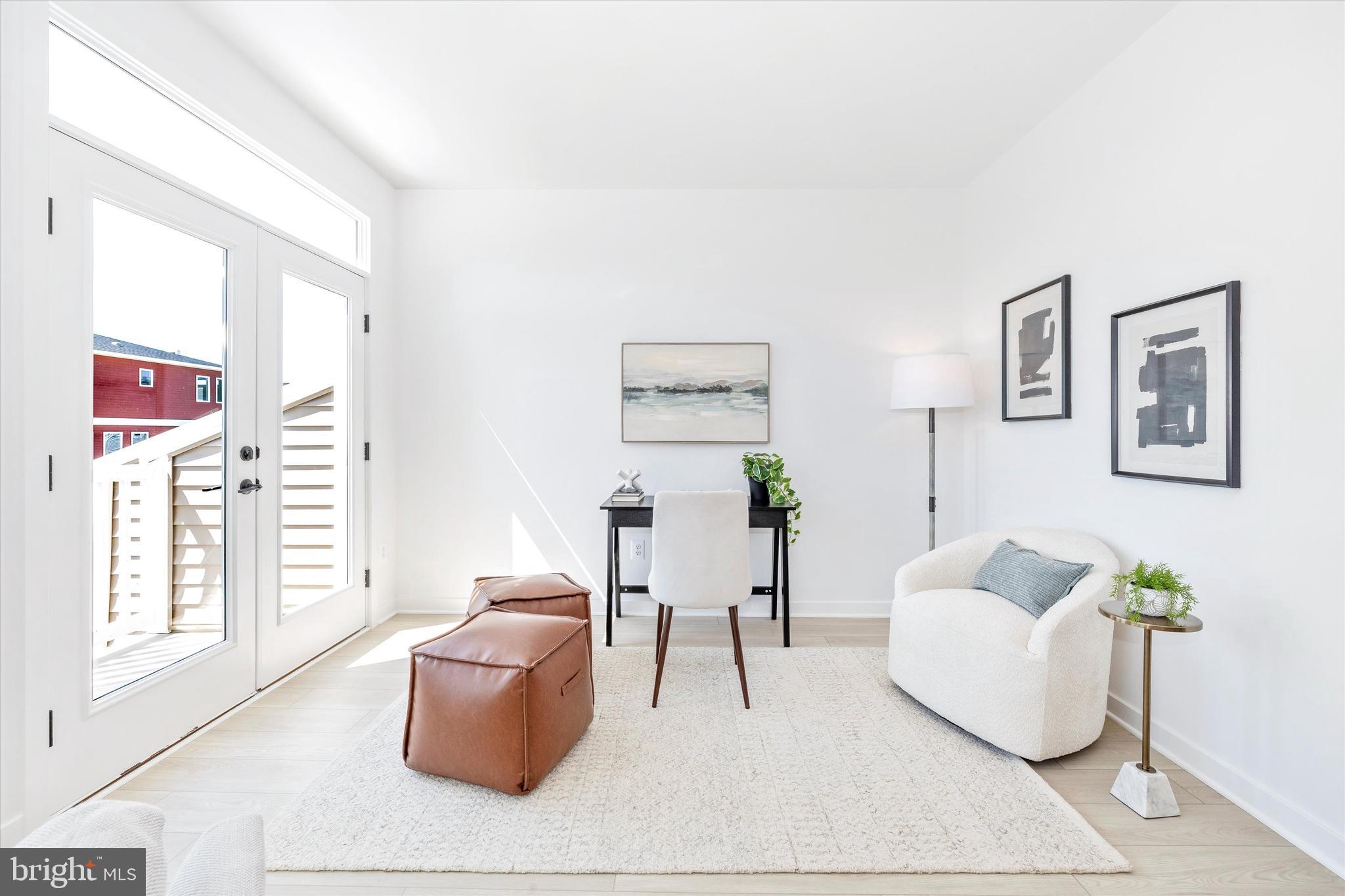 1631 A Blacksmith Way Frederick, MD 21702 - Photo 19 of 35 a living room with furniture and a window