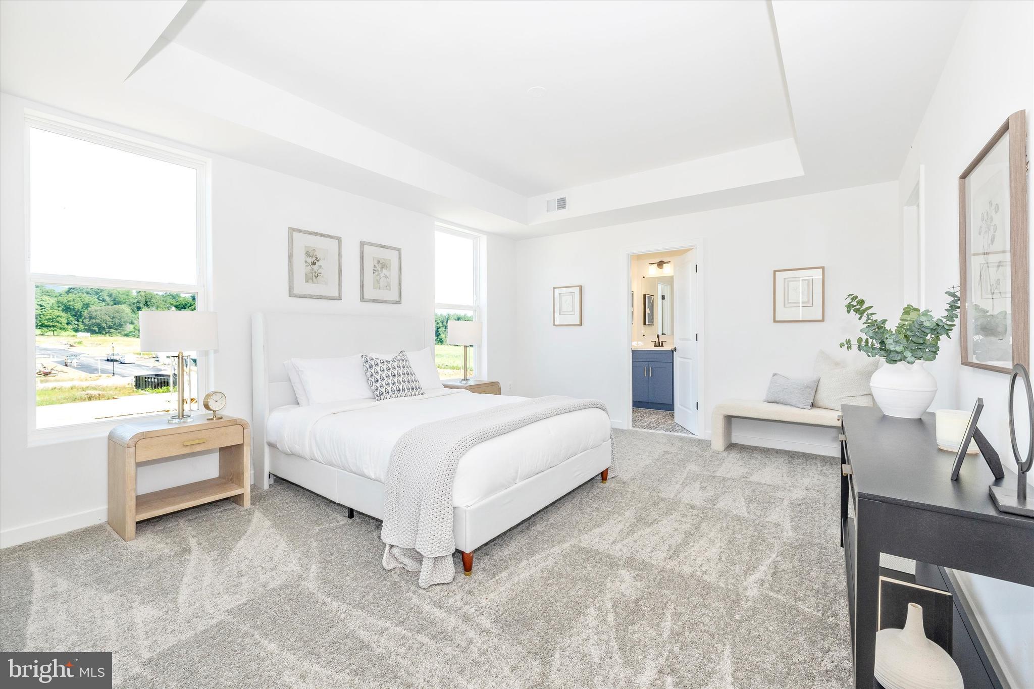 1631 A Blacksmith Way Frederick, MD 21702 - Photo 24 of 35 a spacious bedroom with a bed and a couch