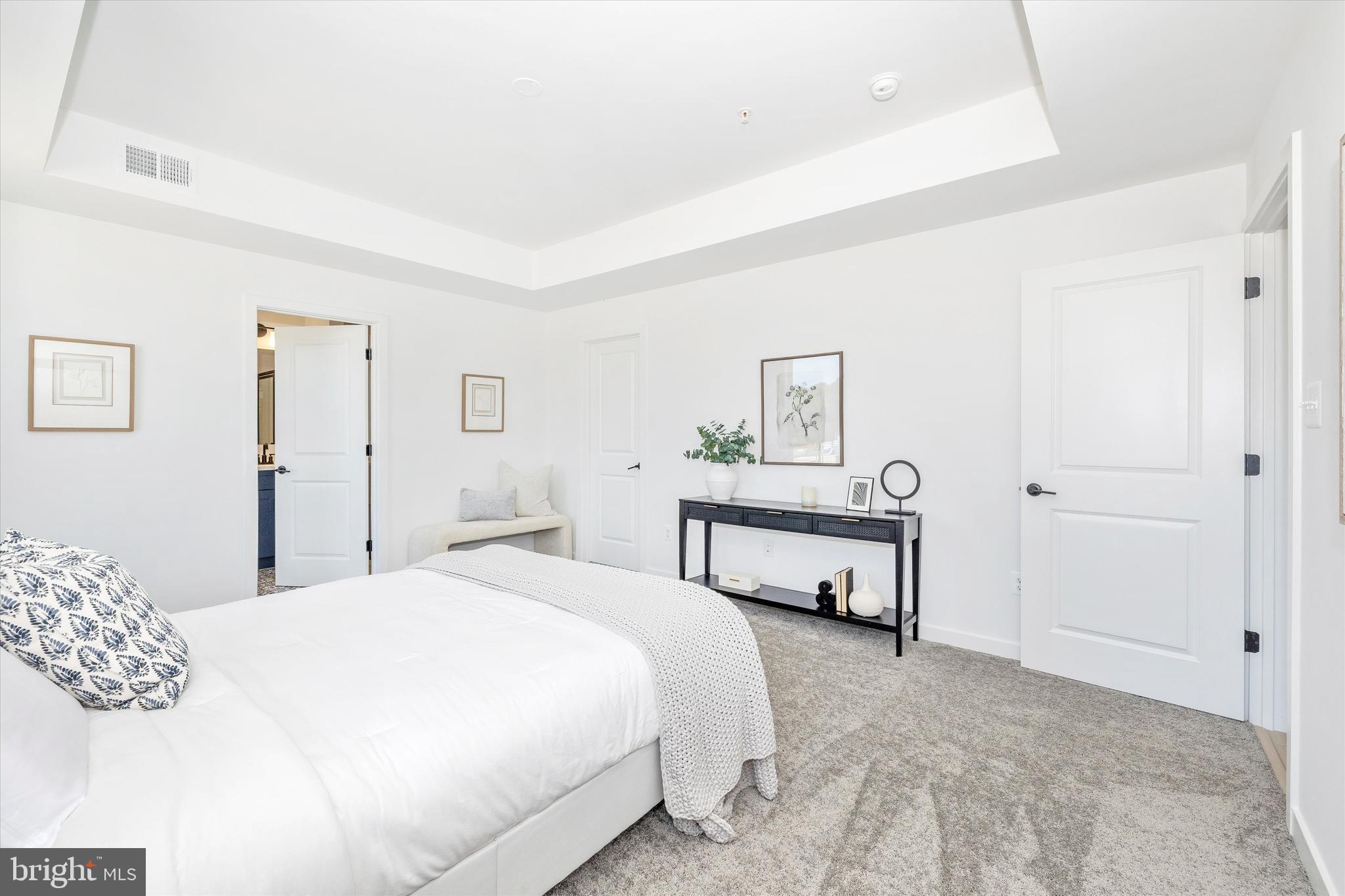 1631 A Blacksmith Way Frederick, MD 21702 - Photo 25 of 35 a bedroom with a bed table and chair