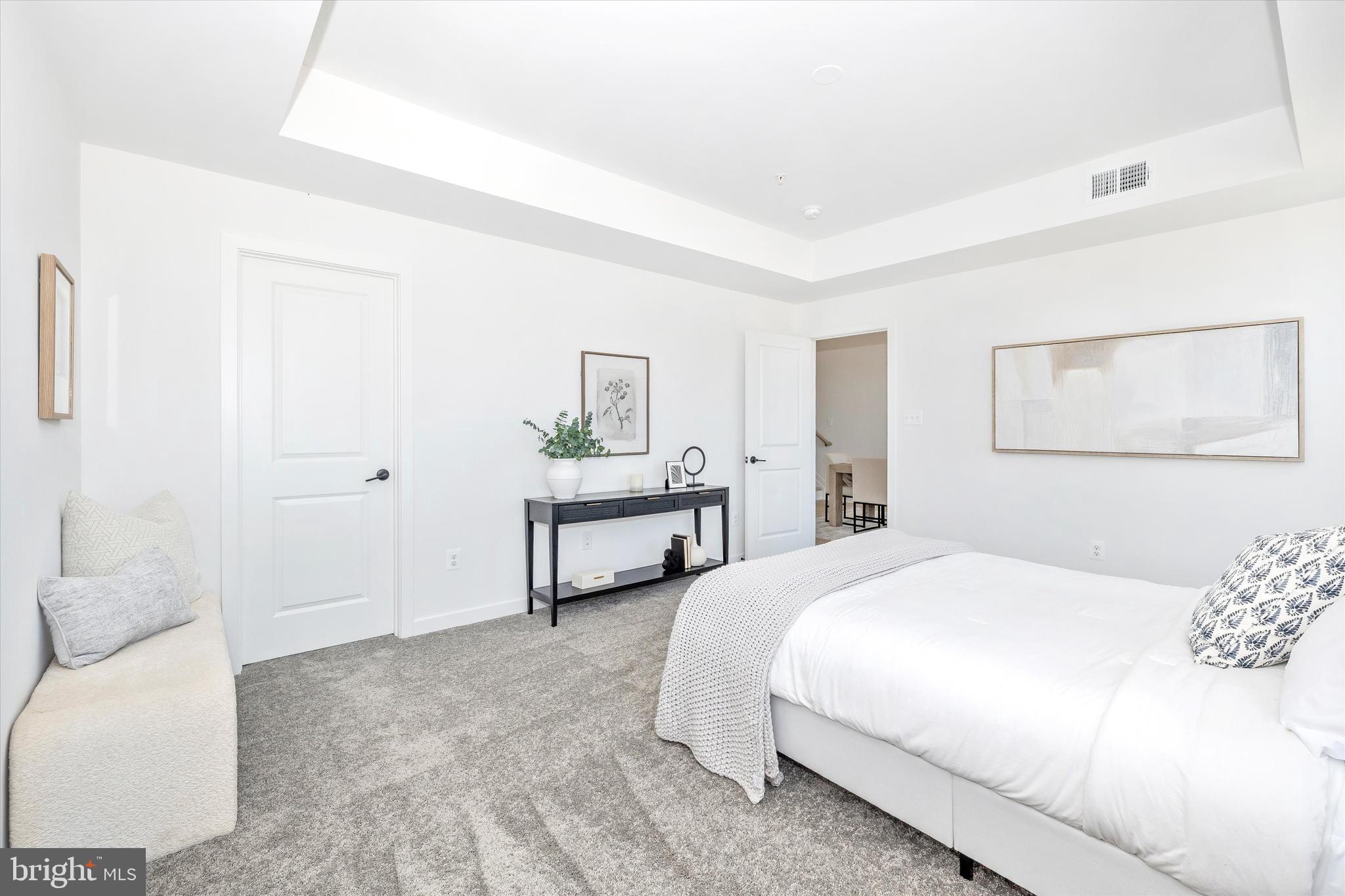 1631 A Blacksmith Way Frederick, MD 21702 - Photo 26 of 35 a bedroom with a bed and a couch