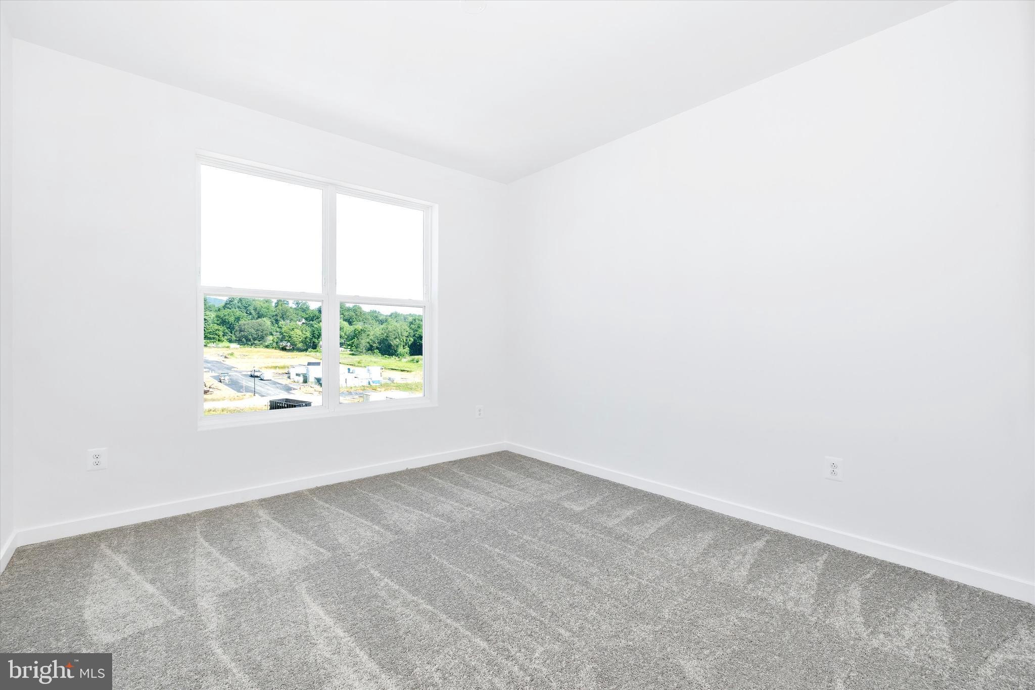 1631 A Blacksmith Way Frederick, MD 21702 - Photo 32 of 35 an empty room with a window