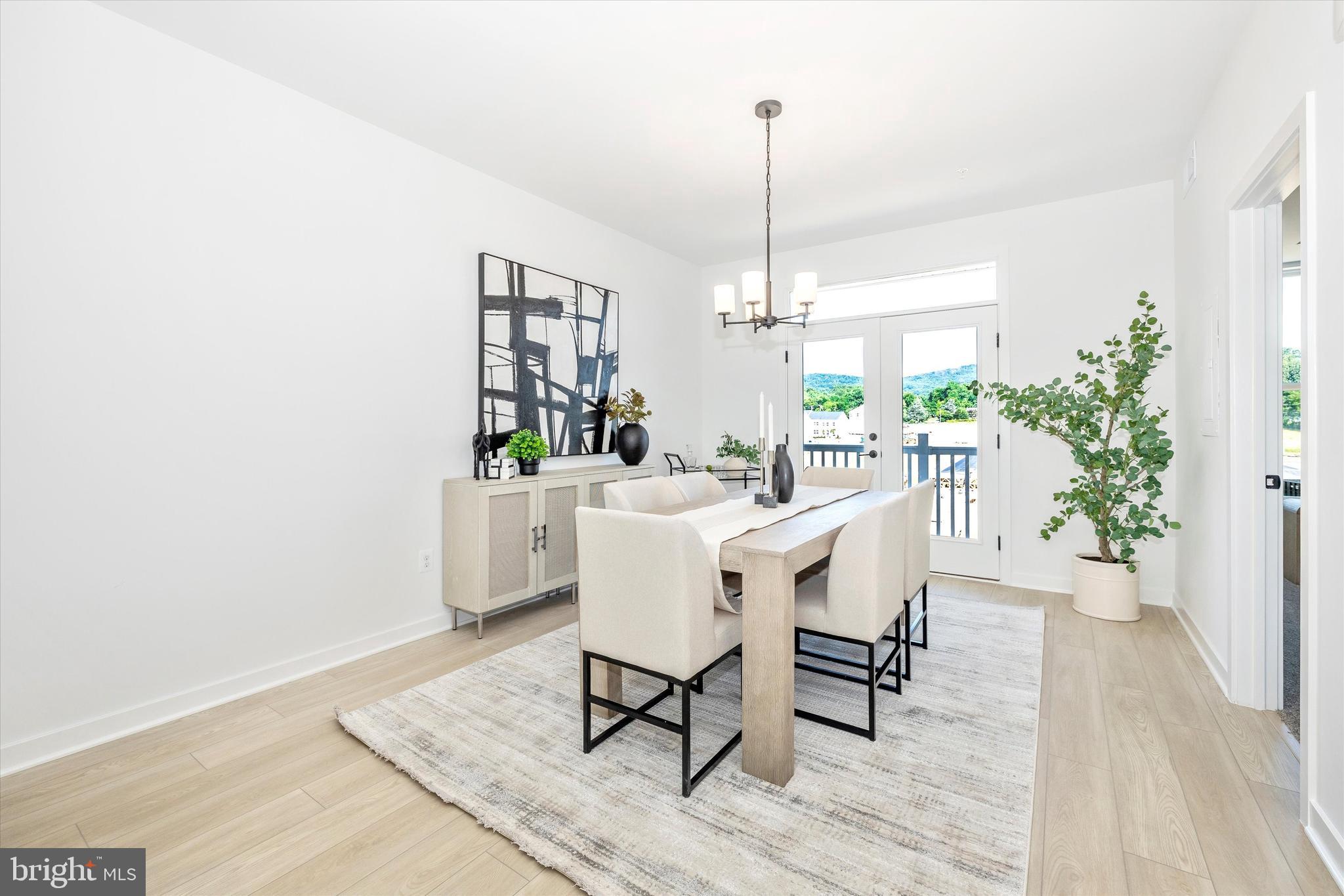 1631 A Blacksmith Way Frederick, MD 21702 - Photo 7 of 35 a dining room with furniture window and wooden floor