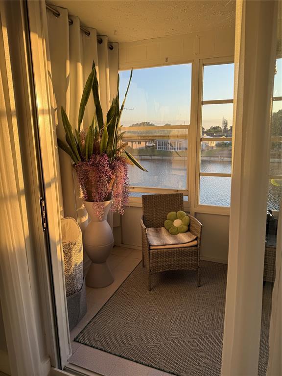9360 Lime Bay Boulevard, Unit 202 Tamarac, FL 33321 - Photo 15 of 15 a living room with furniture and a large window