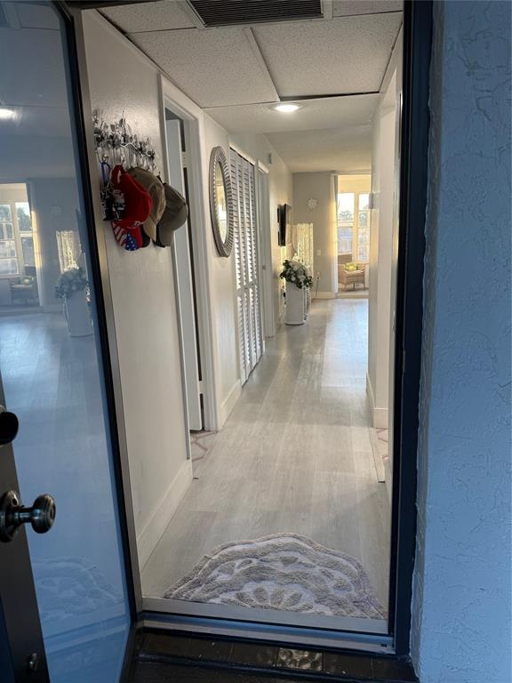 9360 Lime Bay Boulevard, Unit 202 Tamarac, FL 33321 - Photo 2 of 15 a view of a hallway view window and wooden floor