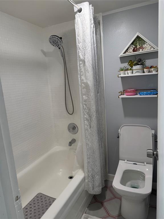 9360 Lime Bay Boulevard, Unit 202 Tamarac, FL 33321 - Photo 7 of 15 a bathroom with a shower a toilet and a shower