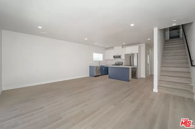 a view of kitchen and wooden floor