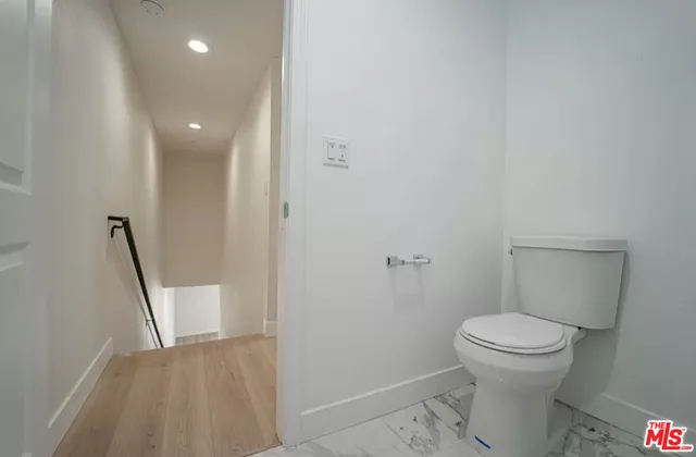 a bathroom with a toilet and a sink