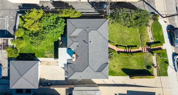 an aerial view of houses with yard
