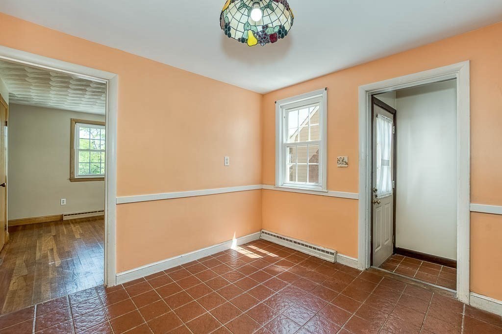 15 Locust Street Dedham, MA 02026 - Photo 14 of 38 wooden floor in an empty room with a window
