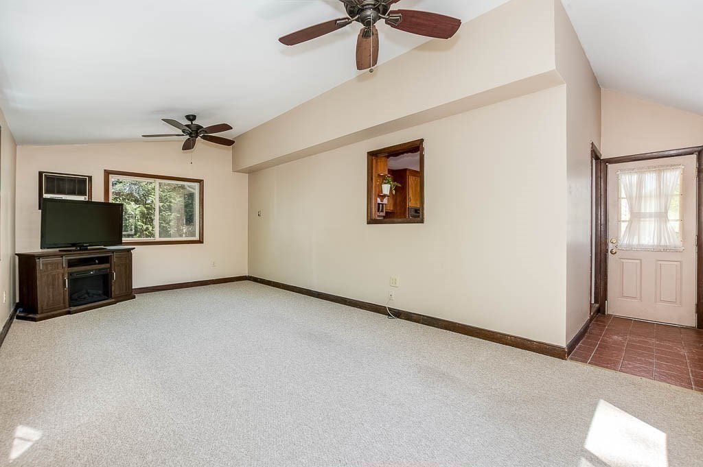 15 Locust Street Dedham, MA 02026 - Photo 16 of 38 a view of a livingroom with a flat screen tv