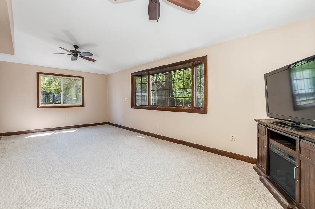 15 Locust Street Dedham, MA 02026 - Photo 17 of 38 an empty room with windows ceiling fan and windows