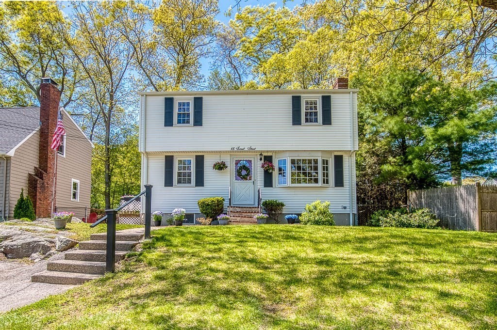 15 Locust Street Dedham, MA 02026 - Photo 2 of 38 front view of a house with a yard