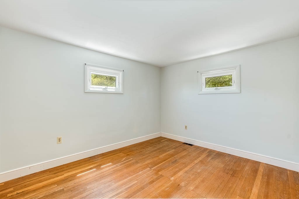 15 Locust Street Dedham, MA 02026 - Photo 26 of 38 a view of empty room with wooden floor