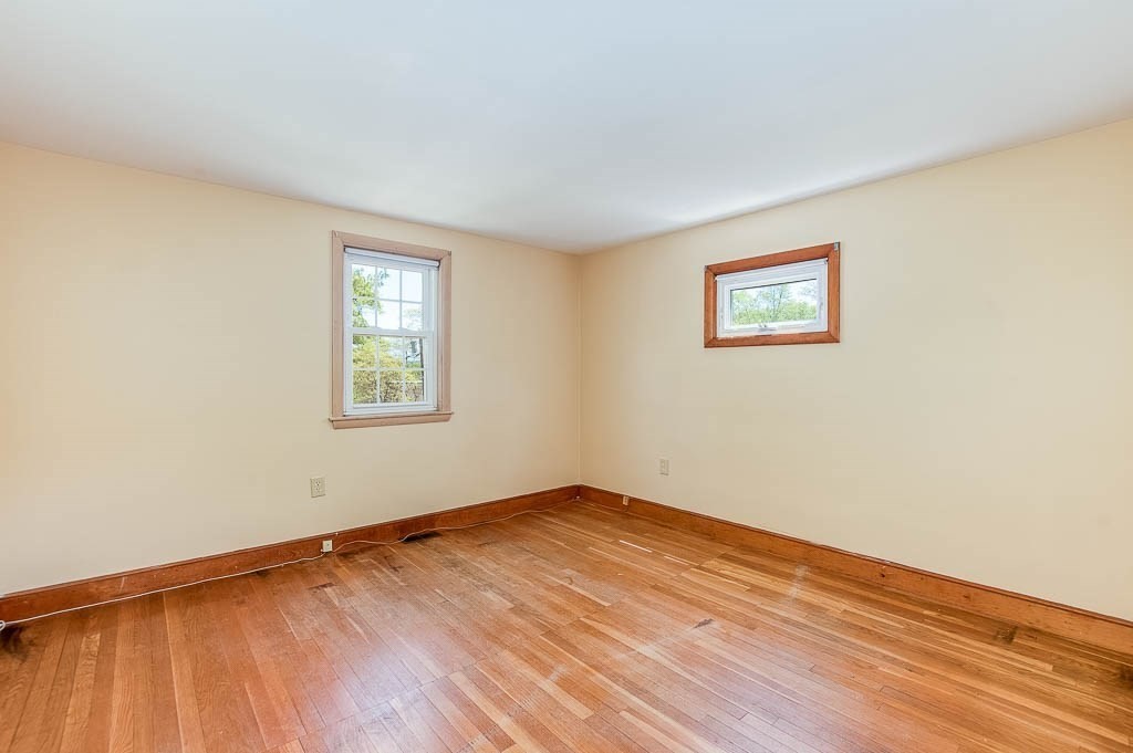15 Locust Street Dedham, MA 02026 - Photo 28 of 38 an empty room with wooden floor and windows