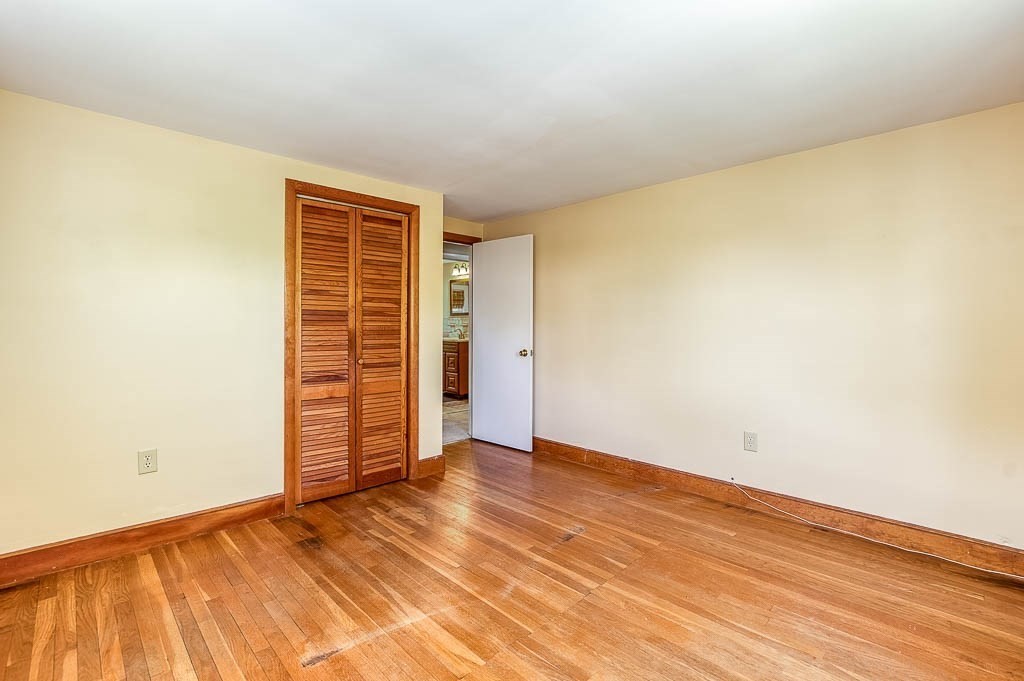 15 Locust Street Dedham, MA 02026 - Photo 29 of 38 an empty room with wooden floor