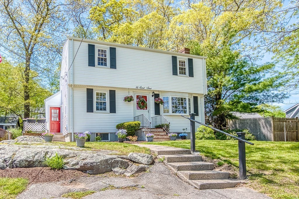 15 Locust Street Dedham, MA 02026 - Photo 3 of 38 a front view of a house with garden