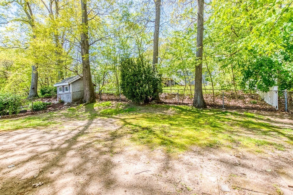 15 Locust Street Dedham, MA 02026 - Photo 35 of 38 a view of a house with backyard and tree
