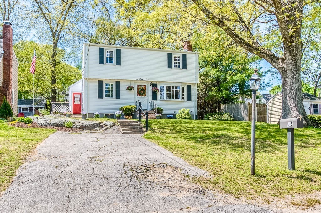 15 Locust Street Dedham, MA 02026 - Photo 4 of 38 a front view of house with small garden and tree