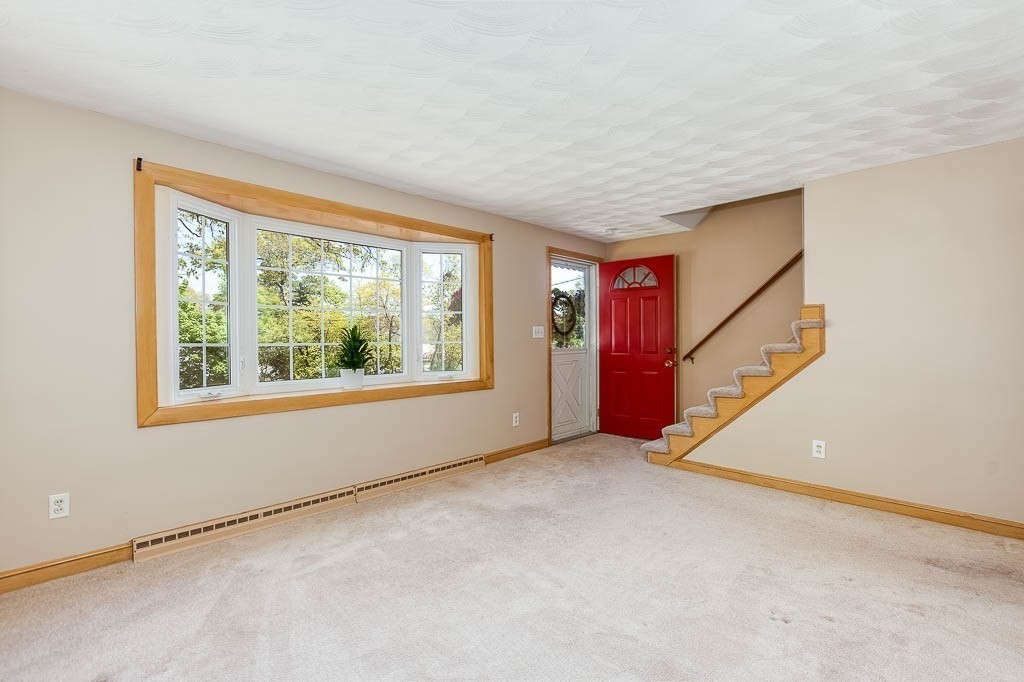 15 Locust Street Dedham, MA 02026 - Photo 5 of 38 an empty room with windows