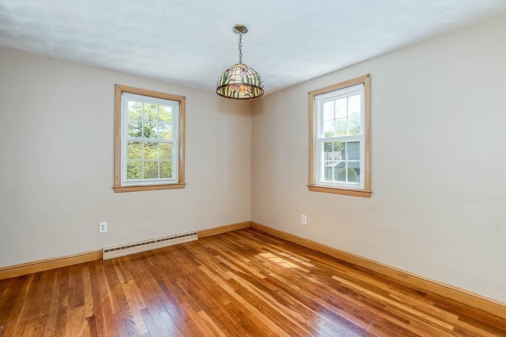 15 Locust Street Dedham, MA 02026 - Photo 9 of 38 a view of a room with wooden floor fan and window