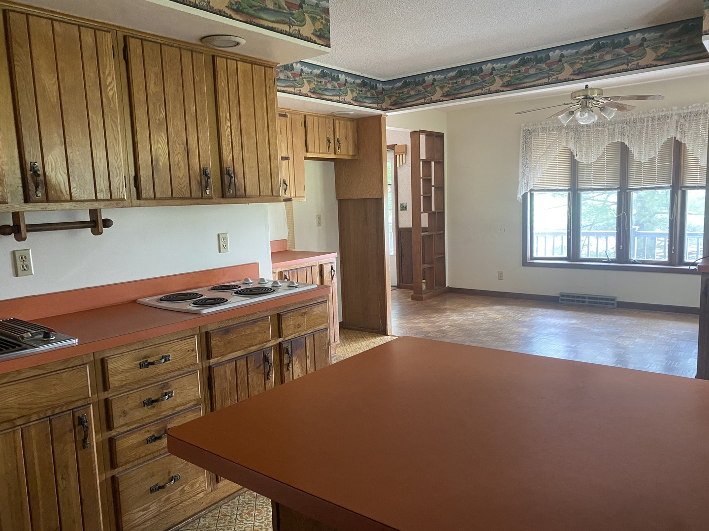 29217 Old Chicago Road La Moille, IL 61330 - Photo 11 of 34 a kitchen with stainless steel appliances a stove a refrigerator and a oven with wooden floor