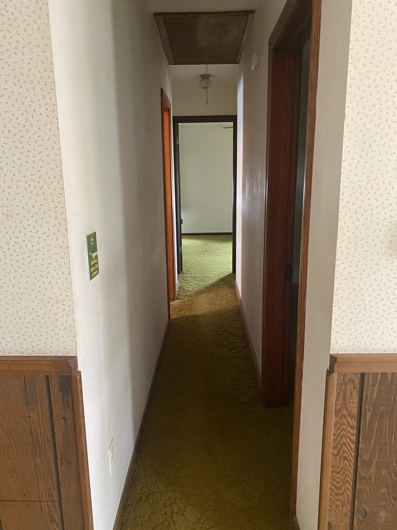 29217 Old Chicago Road La Moille, IL 61330 - Photo 13 of 34 a view of a hallway with wooden floor