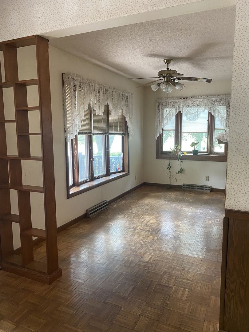 29217 Old Chicago Road La Moille, IL 61330 - Photo 6 of 34 wooden floor that has windows in it