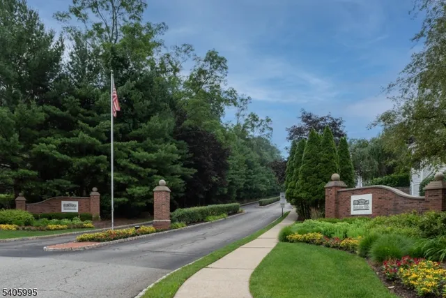 a view of a park chair and table and chairs next to yard