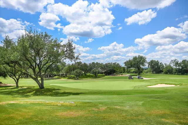 a view of a golf course with a lake