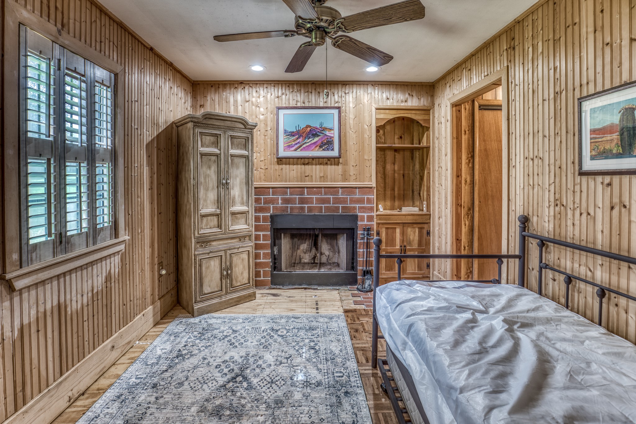 1017 Allen Road Cat Spring, TX 78933 - Photo 35 of 47 a bedroom with a bed and a fireplace