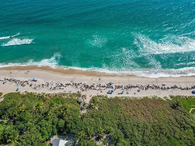 a view of a lake with beach and outdoor space