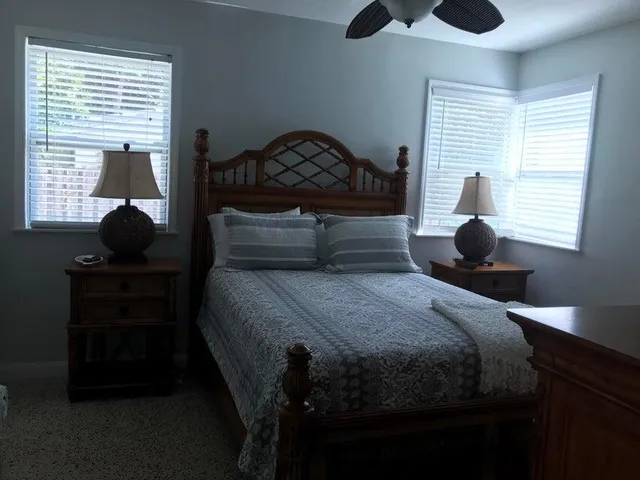 a bedroom with a bed and window
