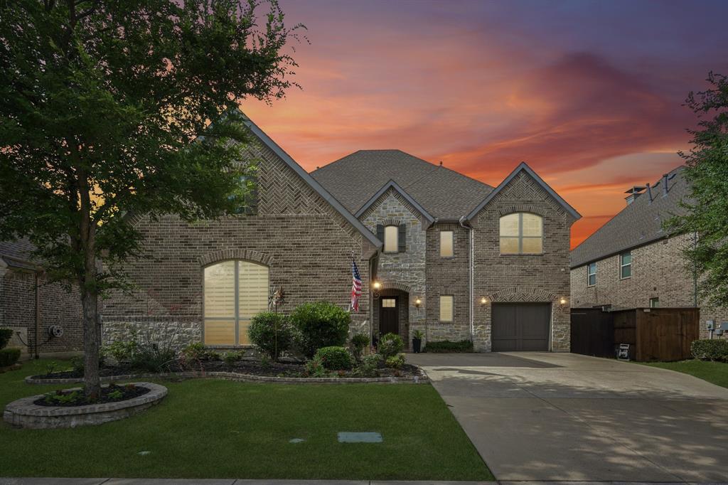 2029 Temperate Drive Allen, TX 75013 - Photo 33 of 40 a front view of a house with a yard and garage