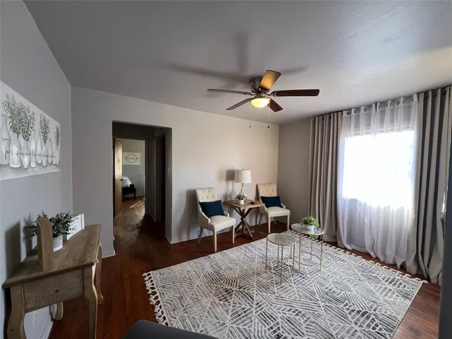 a living room with furniture and a window