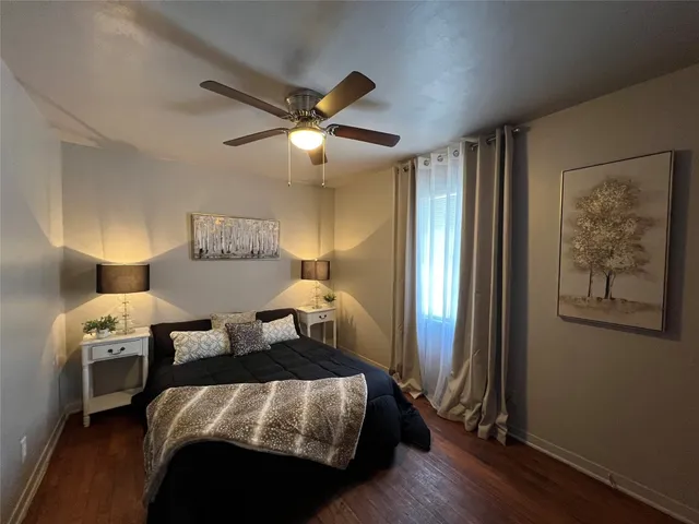 a bedroom with bed and a window