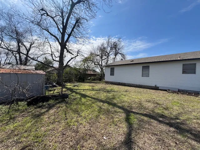 a backyard of a house with lots of green space