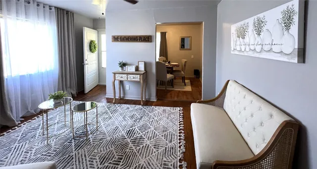 a dining room with furniture and wooden floor