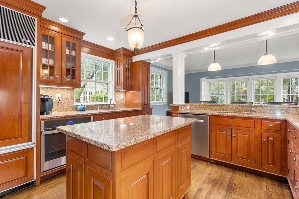 22 Barnstable Road Newton, MA 02465 - Photo 13 of 41 a kitchen with stainless steel appliances granite countertop a sink and a stove