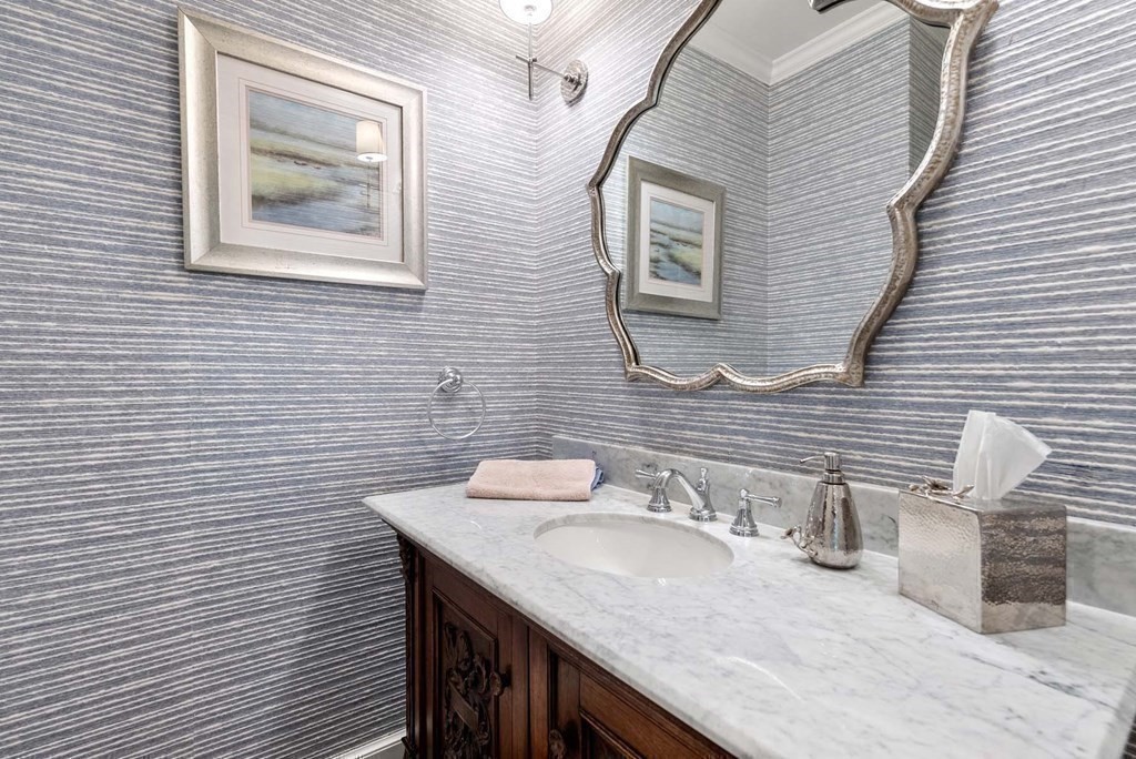 22 Barnstable Road Newton, MA 02465 - Photo 18 of 41 a bathroom with a granite countertop sink and a toilet