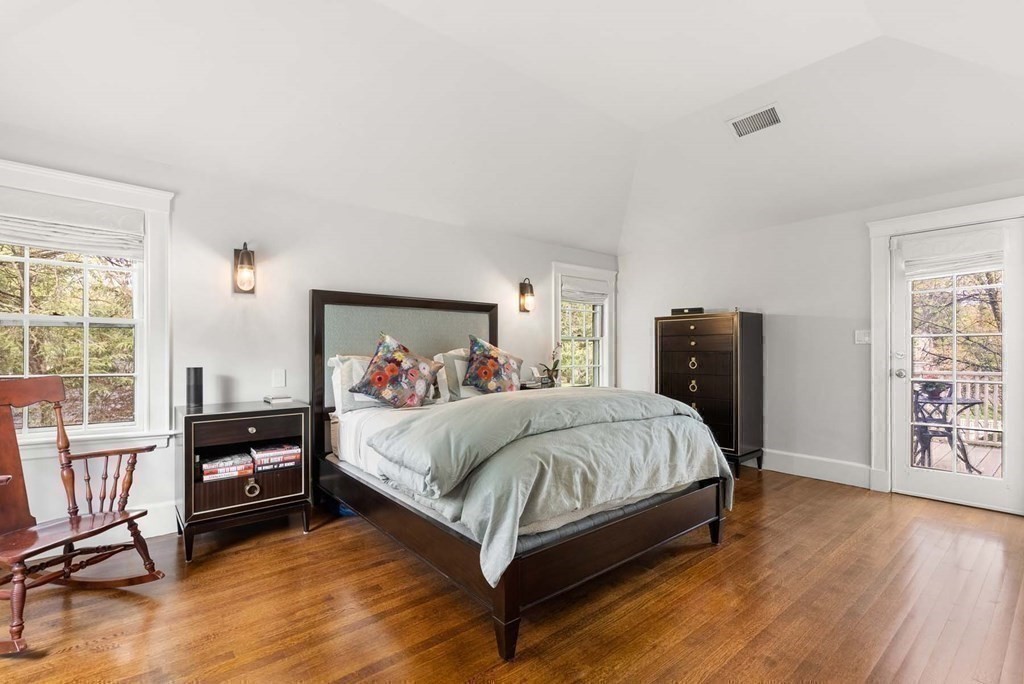22 Barnstable Road Newton, MA 02465 - Photo 20 of 41 a large bedroom with a bed and wooden floor