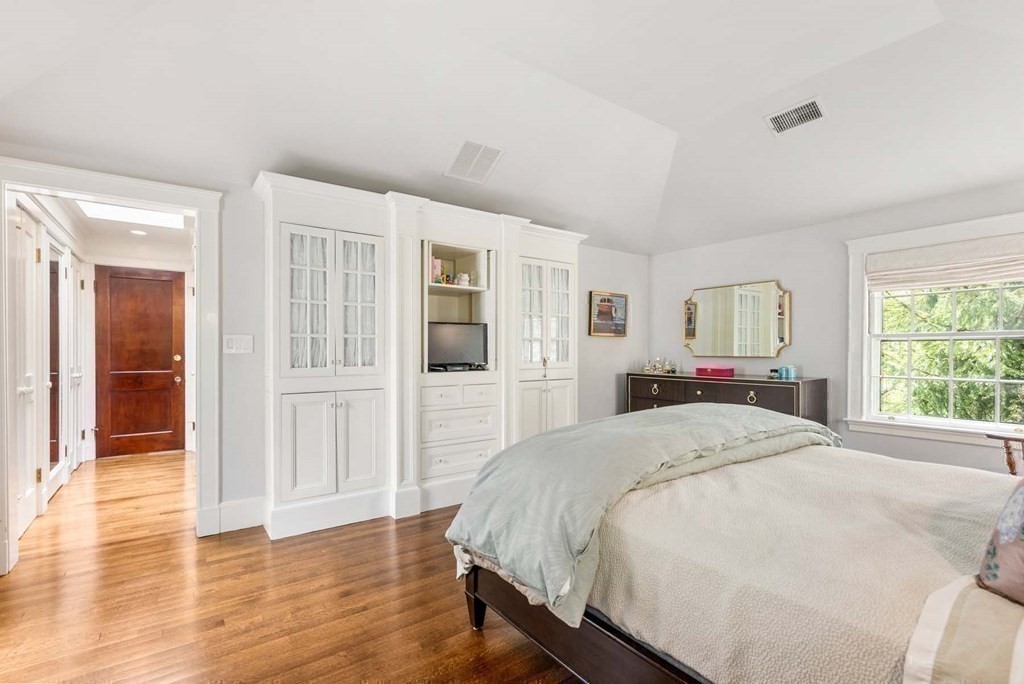 22 Barnstable Road Newton, MA 02465 - Photo 21 of 41 a spacious bedroom with a bed and wooden floor