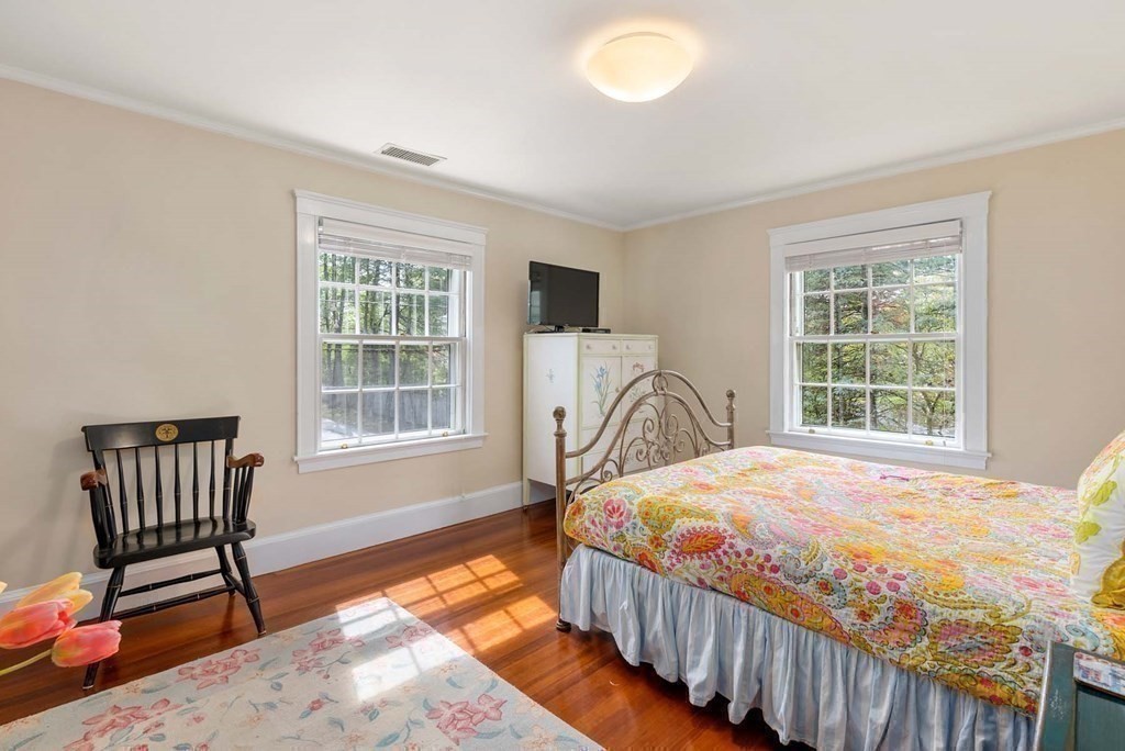 22 Barnstable Road Newton, MA 02465 - Photo 24 of 41 a bedroom with a bed chair and a window