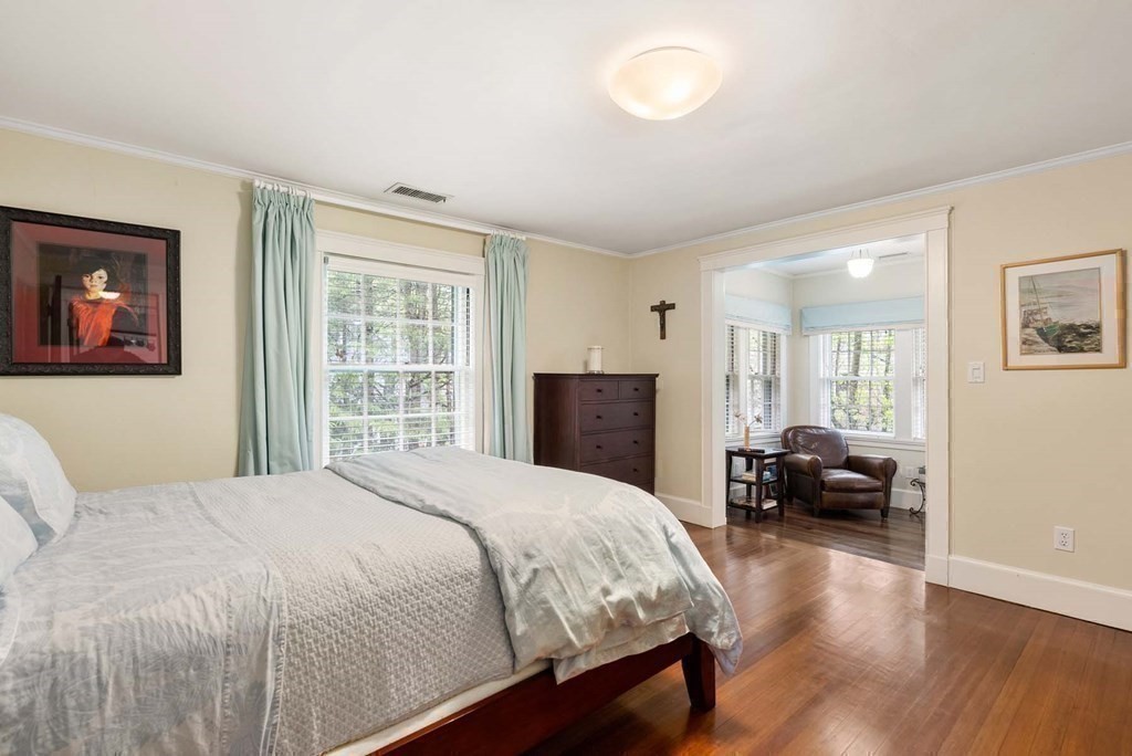 22 Barnstable Road Newton, MA 02465 - Photo 25 of 41 a bedroom with a large bed and a couch