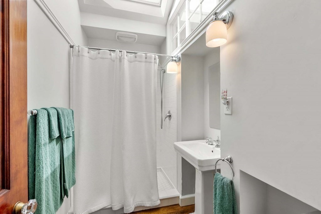 22 Barnstable Road Newton, MA 02465 - Photo 29 of 41 a bathroom with a sink and mirror